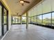Expansive screened patio with ceiling fans and views of the lush landscaping at 772 San Raphael St, Kissimmee, FL 34759