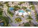 An aerial view of the community's amenities, including a pool, tennis courts, and clubhouse at 8217 Fan Palm Way, Kissimmee, FL 34747