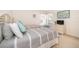 Bright bedroom with two twin beds and natural light at 8217 Fan Palm Way, Kissimmee, FL 34747