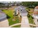 Well-maintained two-story home with manicured lawn, mature landscaping, and a spacious driveway to an attached two-car garage at 8217 Fan Palm Way, Kissimmee, FL 34747