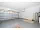 Spacious two-car garage with ample storage space and a clean, well-maintained floor at 8217 Fan Palm Way, Kissimmee, FL 34747