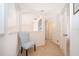 Hallway with chair and railing and white wall at 8217 Fan Palm Way, Kissimmee, FL 34747