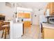 Well-lit kitchen with bright cabinets and modern appliances at 8217 Fan Palm Way, Kissimmee, FL 34747