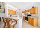 Bright kitchen with a breakfast bar and adjacent appliances at 8217 Fan Palm Way, Kissimmee, FL 34747