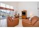 Spacious living room features tile flooring, high ceilings and glass sliding doors leading to the pool area at 8217 Fan Palm Way, Kissimmee, FL 34747