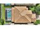 Birds eye view of a private pool and well-maintained tile roof, showcasing backyard enjoyment and solid construction at 9163 Wedge Dr, Davenport, FL 33896