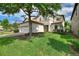 Charming two-story home with a manicured lawn, complemented by a two car garage and lush landscaping at 9163 Wedge Dr, Davenport, FL 33896
