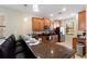 Spacious kitchen featuring granite countertops, stainless steel appliances, and breakfast bar seating at 9163 Wedge Dr, Davenport, FL 33896