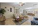 Open living area featuring tile flooring, modern decor and abundant natural light at 9163 Wedge Dr, Davenport, FL 33896