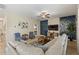 Comfortable living room featuring stylish furniture, tile floors, and a mounted TV at 9163 Wedge Dr, Davenport, FL 33896