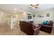 Upstairs loft space with comfortable seating, television, and carpeted floors at 9163 Wedge Dr, Davenport, FL 33896