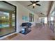 Outdoor patio featuring a grill, table, and chairs, perfect for barbecues and gatherings at 9163 Wedge Dr, Davenport, FL 33896