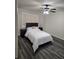 Comfortable bedroom with a queen bed, ceiling fan, and wood-style flooring at 2721 N Poinciana Blvd # 163, Kissimmee, FL 34746