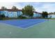 Bright blue tennis court next to the vacation rentals, perfect for some outdoor fun at 2721 N Poinciana Blvd # 163, Kissimmee, FL 34746