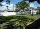 Spacious backyard with a white fence, providing privacy and plenty of room for outdoor activities and relaxation at 1004 Catherine St, Kissimmee, FL 34741