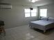 Spacious bedroom featuring tile floors and ample natural light at 1004 Catherine St, Kissimmee, FL 34741