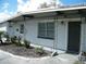 Inviting entrance with a decorative door and landscaping, enhancing curb appeal and creating a warm welcome at 1004 Catherine St, Kissimmee, FL 34741