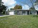 A cozy home with a well-kept lawn and a clean exterior, perfect for comfortable living at 1004 Catherine St, Kissimmee, FL 34741