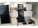Charming kitchen with modern appliances, white cabinets, and washer/dryer combination at 1004 Catherine St, Kissimmee, FL 34741