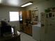 Functional kitchen with wood cabinets and white appliances at 1004 Catherine St, Kissimmee, FL 34741