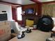 Relaxing living room area, complete with a brick fireplace and entertainment center at 1004 Catherine St, Kissimmee, FL 34741