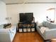 Cozy living room with light blue couches and tile flooring at 1004 Catherine St, Kissimmee, FL 34741