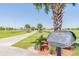 Pristine baseball field with palm trees and well-maintained walkway, perfect for outdoor activities and Gathering fun at 1038 Sabine Pl, Kissimmee, FL 34759