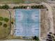 Aerial view of the community basketball court near a sidewalk and green space at 1038 Sabine Pl, Kissimmee, FL 34759