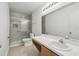 Modern bathroom featuring walk-in shower, vanity, and sleek fixtures at 1038 Sabine Pl, Kissimmee, FL 34759