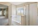 Clean bathroom features a soaking tub and glass-enclosed shower, providing a relaxing retreat at 1038 Sabine Pl, Kissimmee, FL 34759