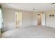 Spacious carpeted bedroom with multiple doorways at 1038 Sabine Pl, Kissimmee, FL 34759