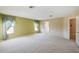 Large bedroom with neutral carpeting and natural light from a window at 1038 Sabine Pl, Kissimmee, FL 34759