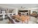 Bright dining area with modern table set and an open floorplan to kitchen and living room at 1038 Sabine Pl, Kissimmee, FL 34759