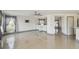 Spacious living room with tiled floors, large windows, and open concept design at 1038 Sabine Pl, Kissimmee, FL 34759