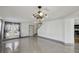 Spacious living room with tile flooring and neutral paint is ready for furnishings at 1038 Sabine Pl, Kissimmee, FL 34759