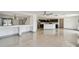 Expansive open floor plan featuring living area, kitchen, and dining space with tiled floors at 1038 Sabine Pl, Kissimmee, FL 34759