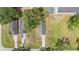Aerial view of fenced property showcasing the house, driveway, and large grassy backyard at 108 Pearlwood St, Orlando, FL 32811