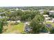 Expansive aerial view of the home featuring lush trees and a spacious yard at 108 Pearlwood St, Orlando, FL 32811