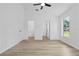 Bright, spacious bedroom has a ceiling fan, wood-look floors and views of the closets at 108 Pearlwood St, Orlando, FL 32811