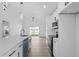 Bright, open kitchen featuring a center island, modern appliances, and ample counter space at 108 Pearlwood St, Orlando, FL 32811
