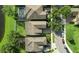 An aerial view showcasing the house's roof, yard, and surrounding community, highlighting the property's location at 12867 Woodmere Close Dr, Windermere, FL 34786