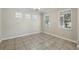 Bright dining room featuring tile floors, three windows, and neutral paint at 12867 Woodmere Close Dr, Windermere, FL 34786