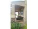 Charming covered front porch with ample seating offers a welcoming entrance to the home at 12867 Woodmere Close Dr, Windermere, FL 34786