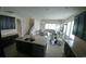 Open-concept kitchen with dark cabinets, modern appliances, and a center island, perfect for entertaining at 12867 Woodmere Close Dr, Windermere, FL 34786
