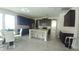 Bright open kitchen with a center island, dark wood cabinets, and a connected dining area at 12867 Woodmere Close Dr, Windermere, FL 34786