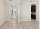 Bright living room with tile floors, arched doorways, and neutral paint at 12867 Woodmere Close Dr, Windermere, FL 34786