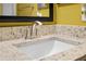 Close up of a bathroom granite countertop and sink with a chrome faucet at 13427 Fairway Glen Dr # 103, Orlando, FL 32824