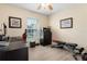 Bedroom or home office with a window, desk, printer, and workout bench at 13427 Fairway Glen Dr # 103, Orlando, FL 32824