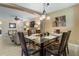 Dining area featuring tile flooring, seating for six, and an overhead light fixture at 13427 Fairway Glen Dr # 103, Orlando, FL 32824