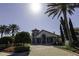 Community entrance featuring attractive landscaping, stately buildings, and a welcoming atmosphere at 15079 Guava Bay Dr, Winter Garden, FL 34787
